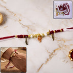 Ganesh Charm Rakhi with Feather Pendants